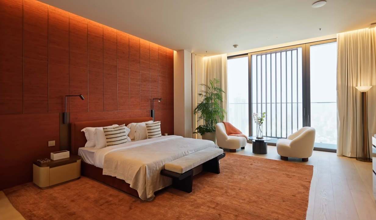 Primary Bedroom with Red Accents & Natural Light
